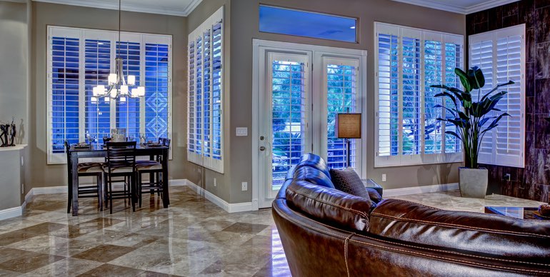Miami great room with classic shutters and modern lighting.
